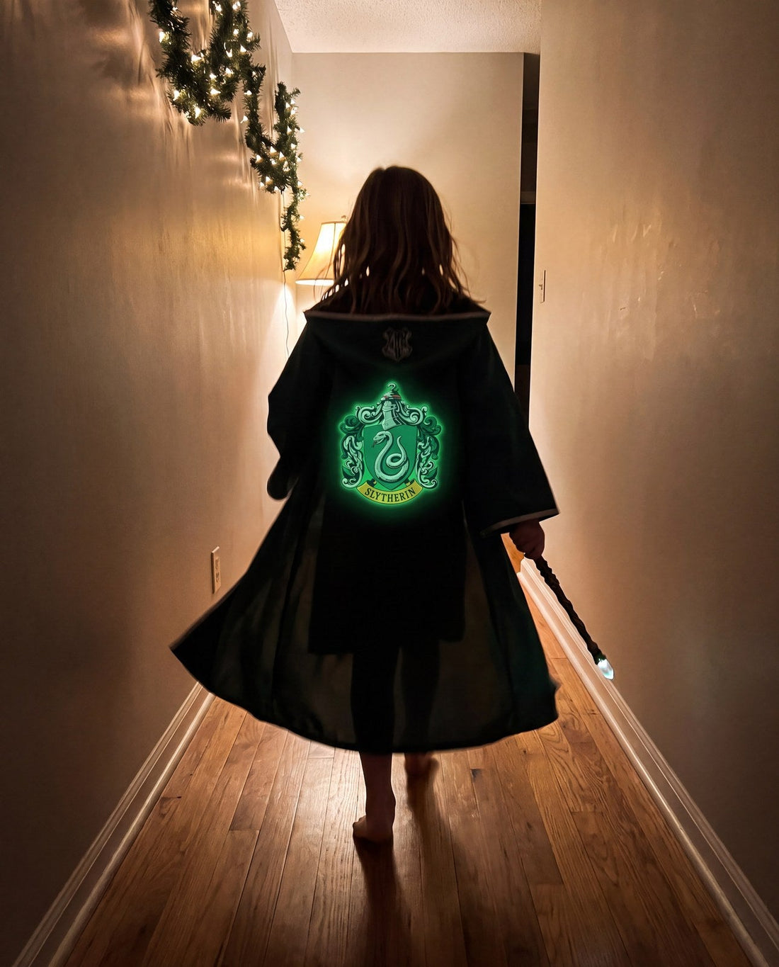 The Slytherin shield on the back of the cloak: tags from behind count too
